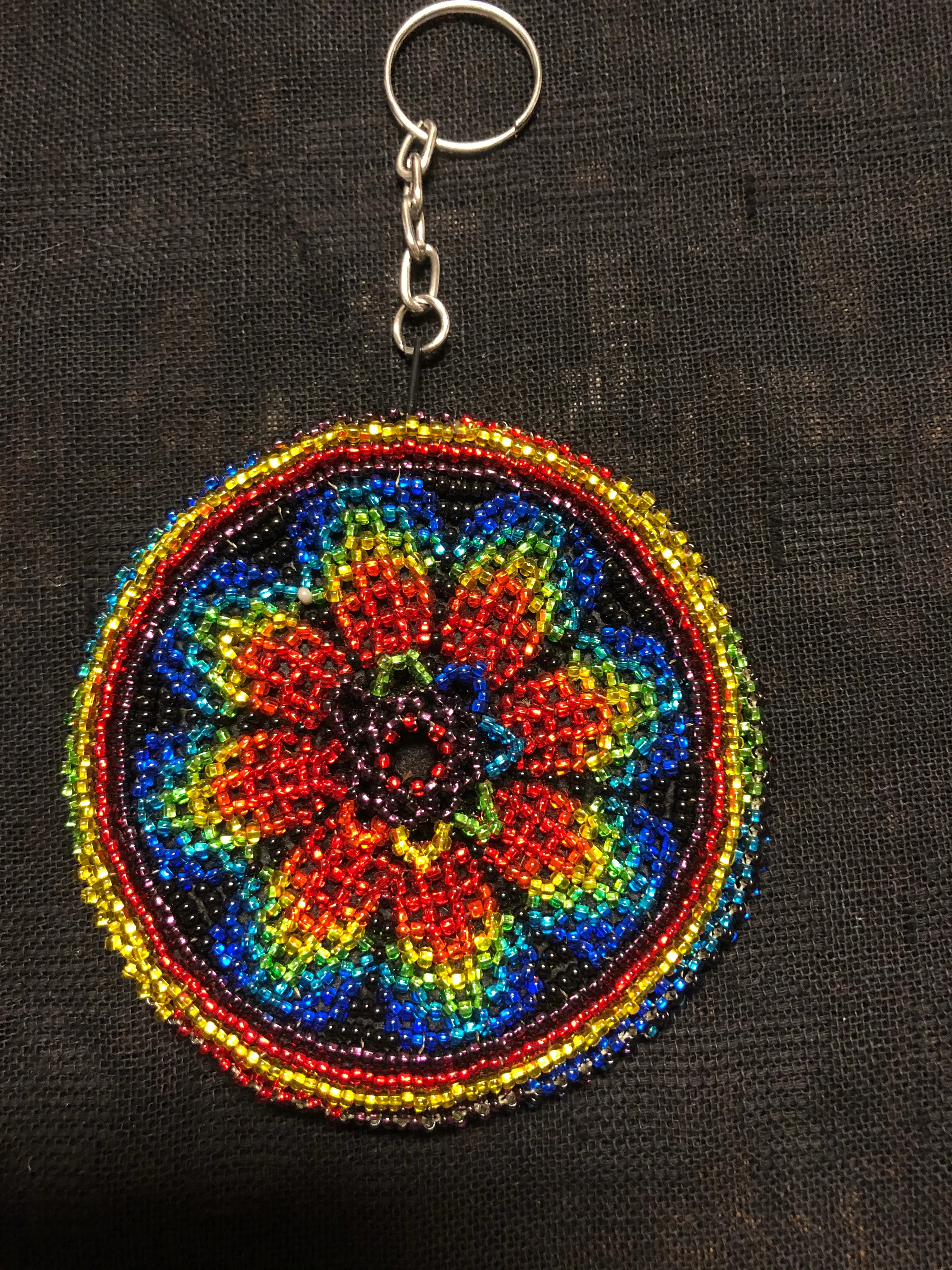 Guatemalan handcrafted glass bead round change purse with key ring. 3.5” diameter.