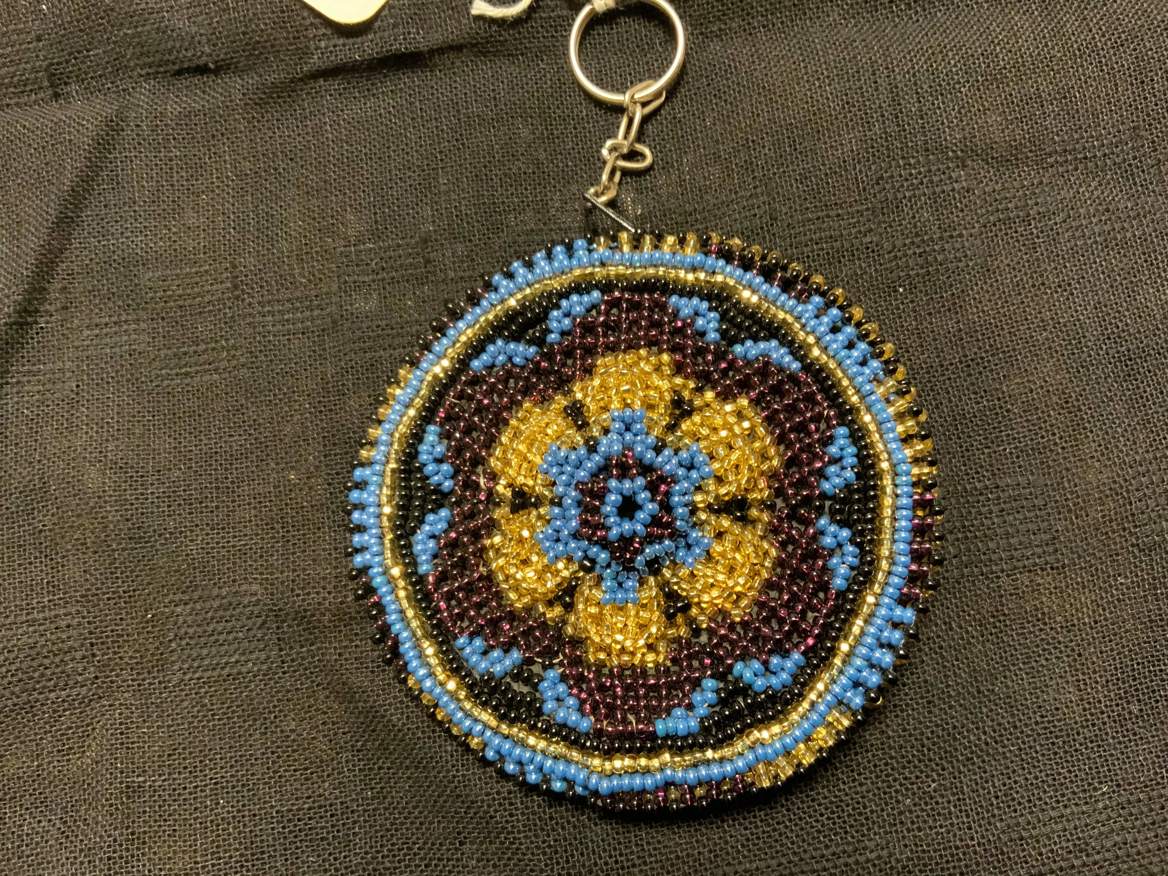 Guatemalan handcrafted glass bead round change purse with key ring. 3.5” diameter.