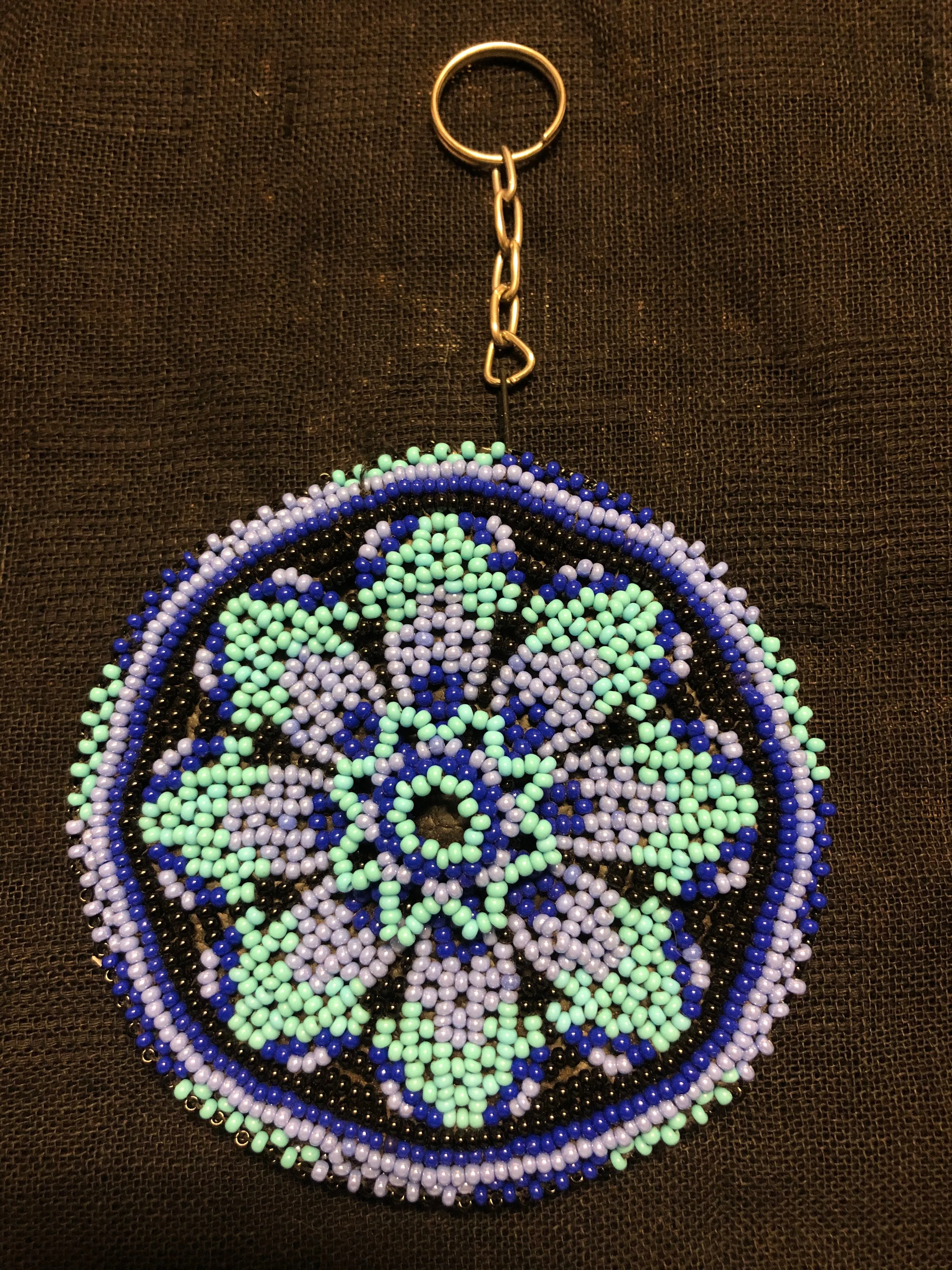 Guatemalan handcrafted glass bead round change purse with key ring. 3.5” diameter.