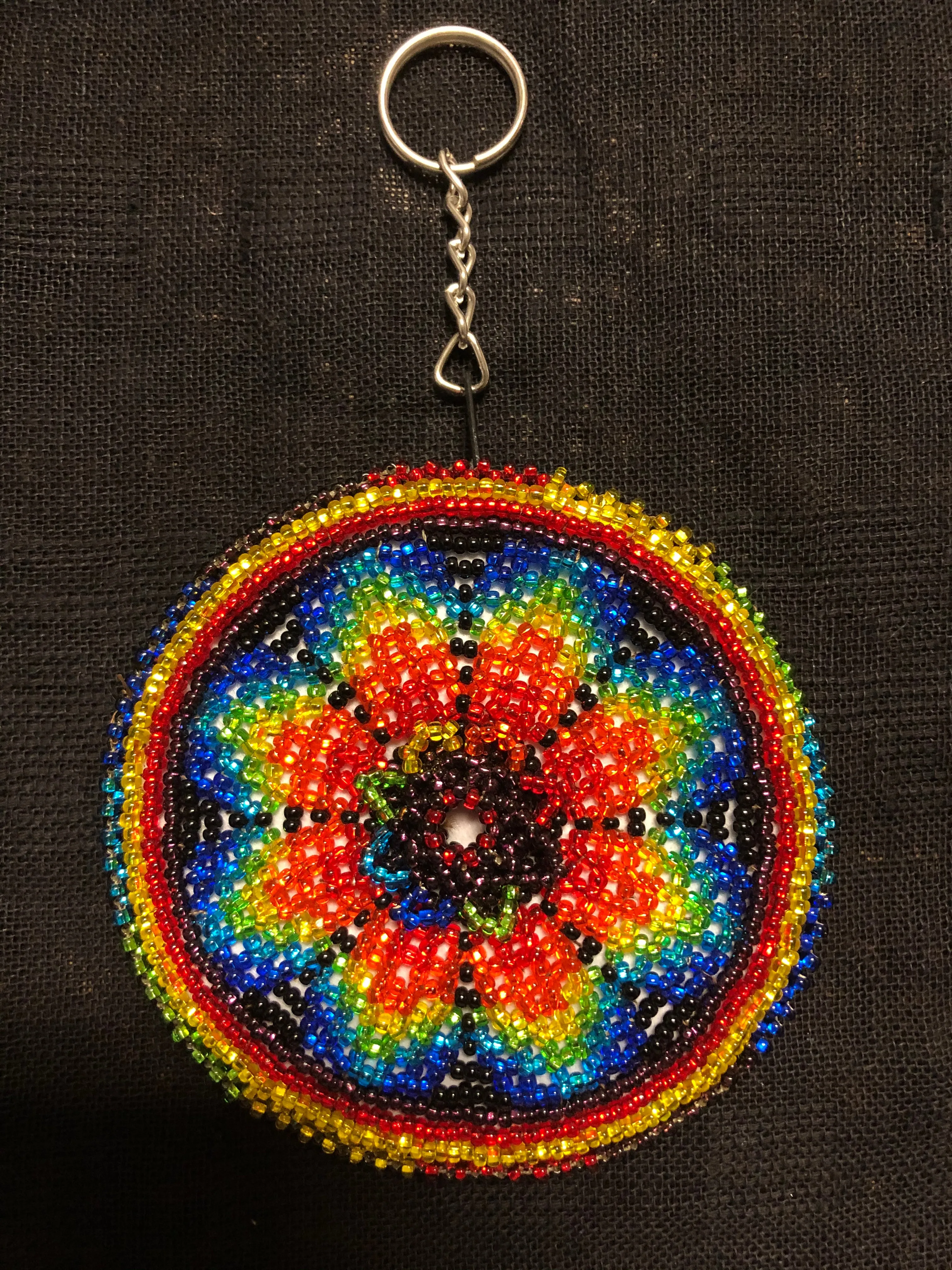 Guatemalan handcrafted glass bead round change purse with key ring. 3.5” diameter.