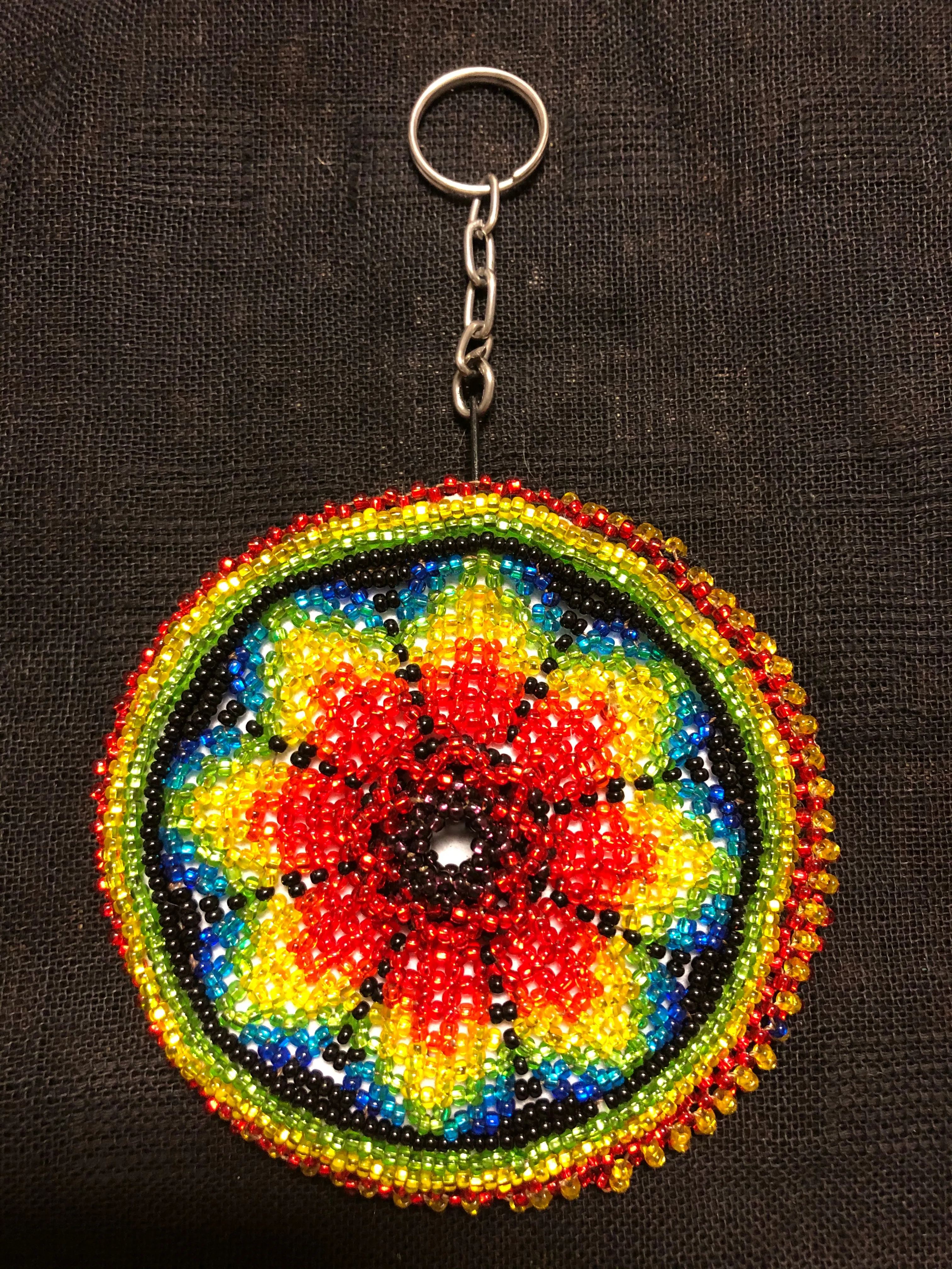 Guatemalan handcrafted glass bead round change purse with key ring. 3.5” diameter.