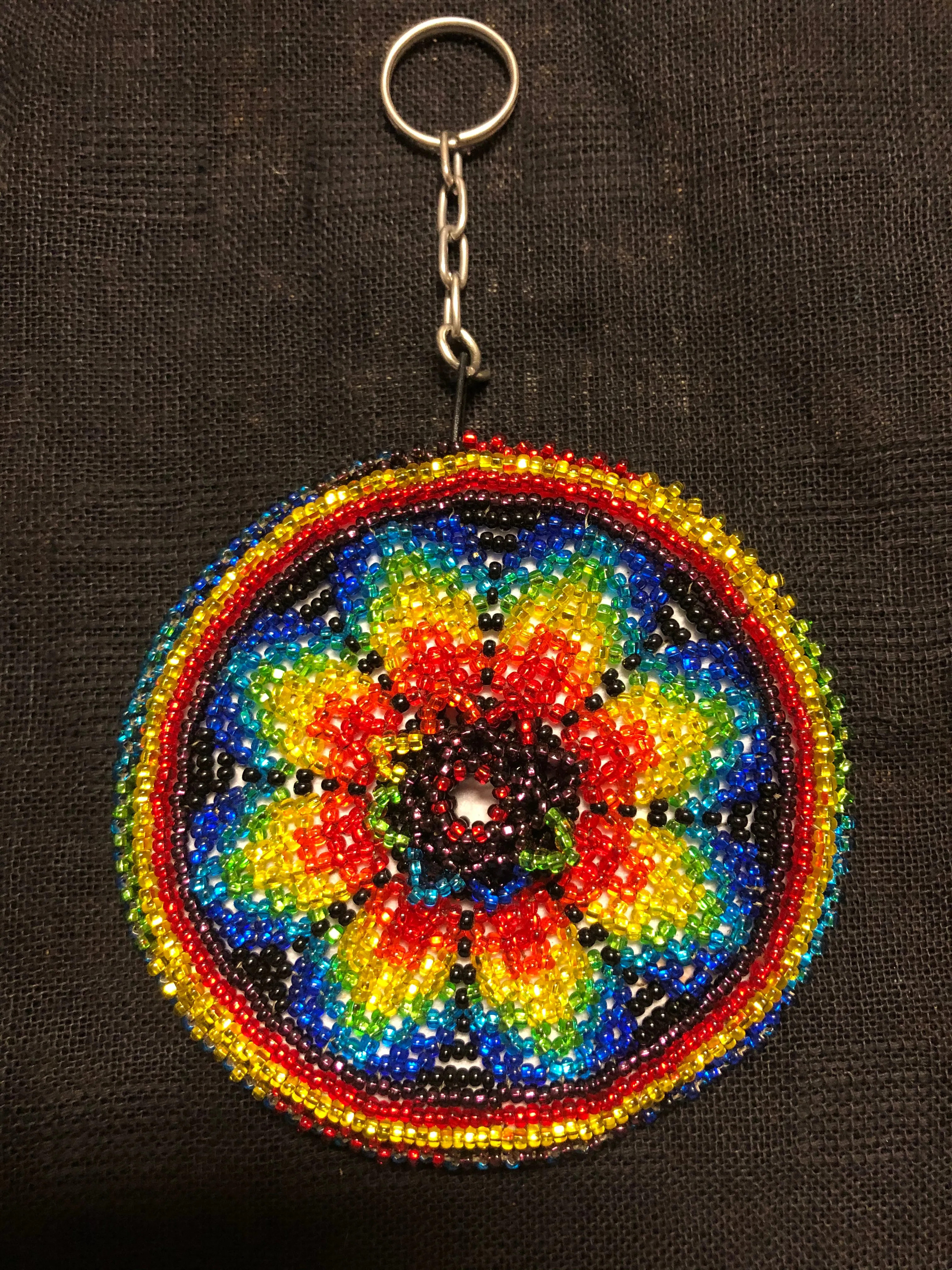 Guatemalan handcrafted glass bead round change purse with key ring. 3.5” diameter.