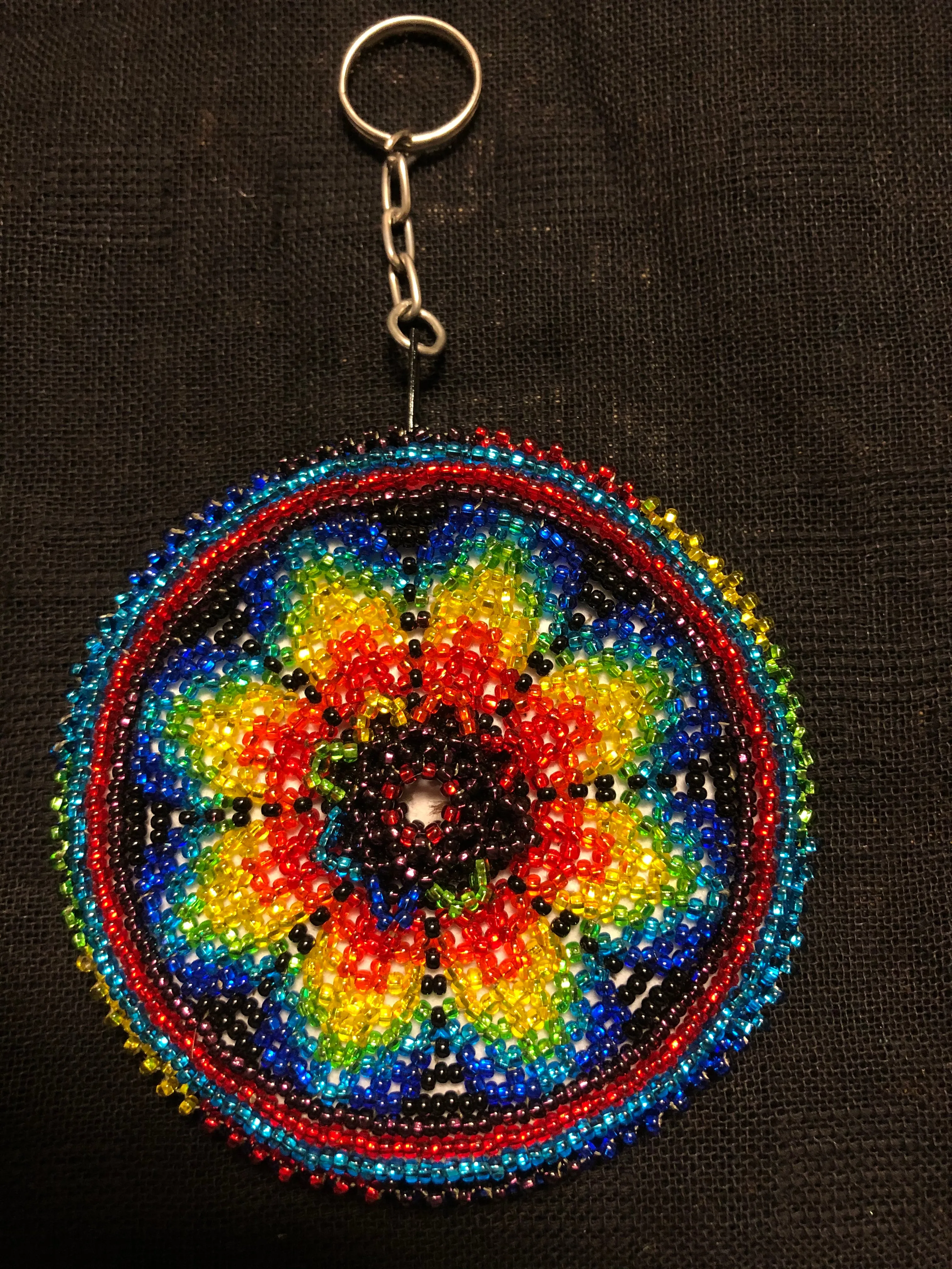 Guatemalan handcrafted glass bead round change purse with key ring. 3.5” diameter.